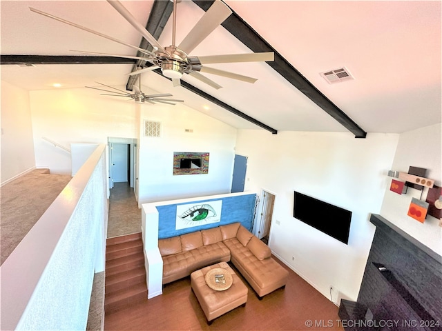 living room featuring dark wood-type flooring, ceiling fan, and vaulted ceiling with beams