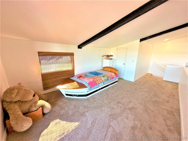 bedroom featuring lofted ceiling with beams and carpet floors