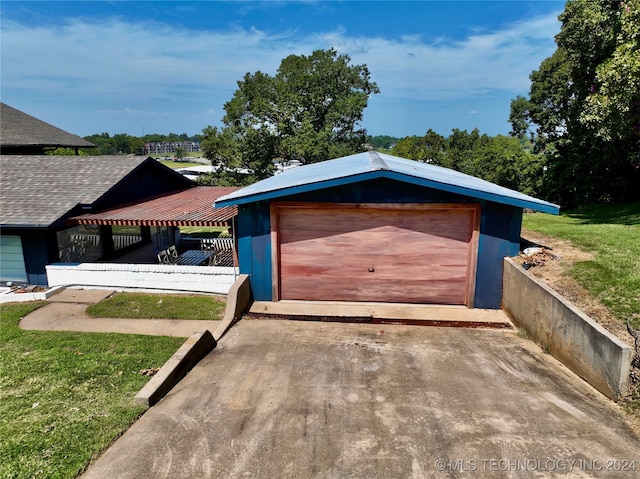 garage featuring a yard