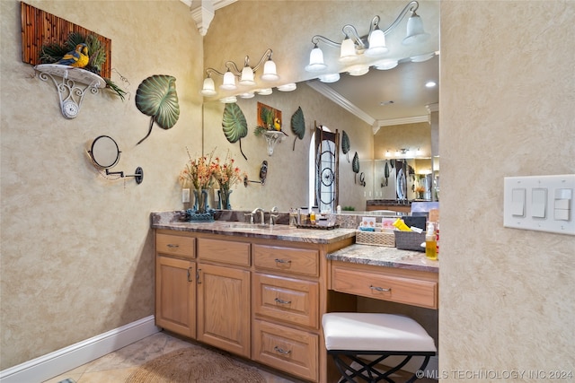 bathroom with tile flooring, vanity with extensive cabinet space, and ornamental molding