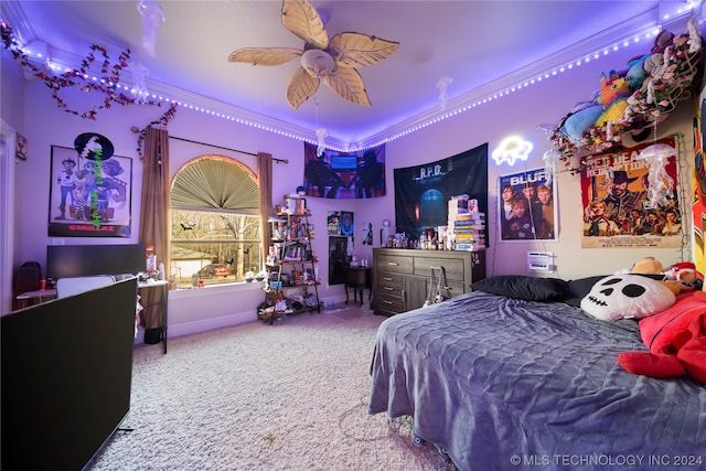 carpeted bedroom with ceiling fan and crown molding