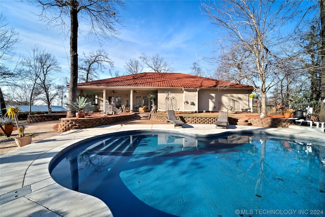 view of swimming pool with a patio area