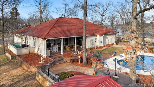 back of house featuring a patio