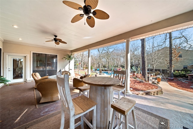 sunroom / solarium with ceiling fan