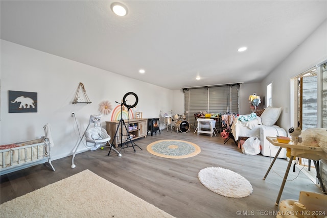 recreation room with dark hardwood / wood-style floors