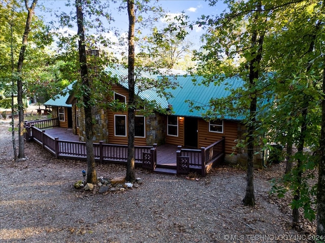 rear view of house with a deck