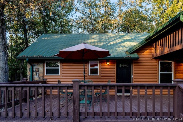 view of front of house with a wooden deck