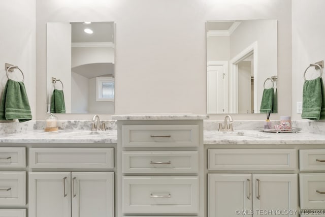 bathroom featuring vanity and ornamental molding