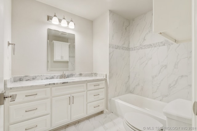 full bathroom featuring tile floors, tiled shower / bath, toilet, and vanity