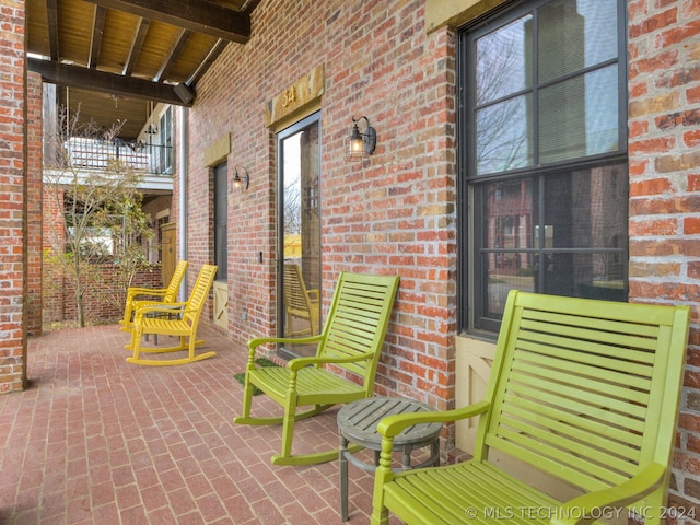 view of patio with a balcony