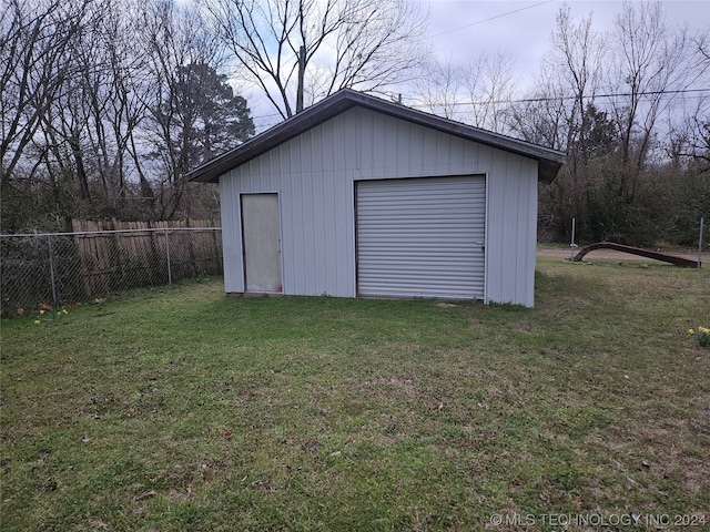 garage featuring a yard