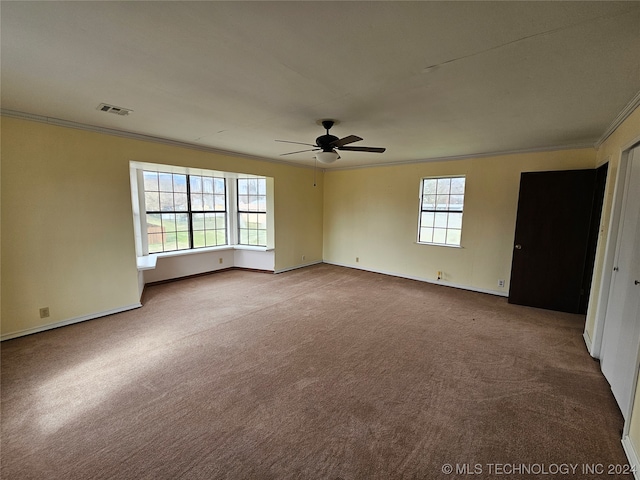 unfurnished room featuring carpet, ceiling fan, and ornamental molding