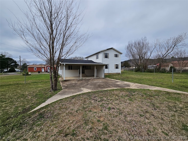 view of front of home with a front lawn and a carport