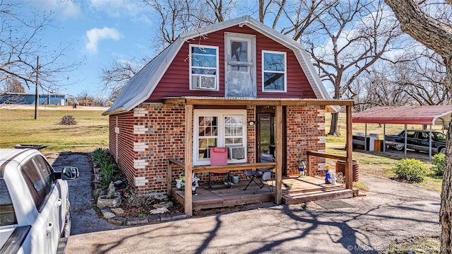 rear view of house with a carport