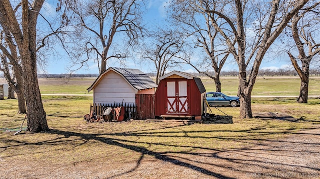 view of shed / structure with a lawn