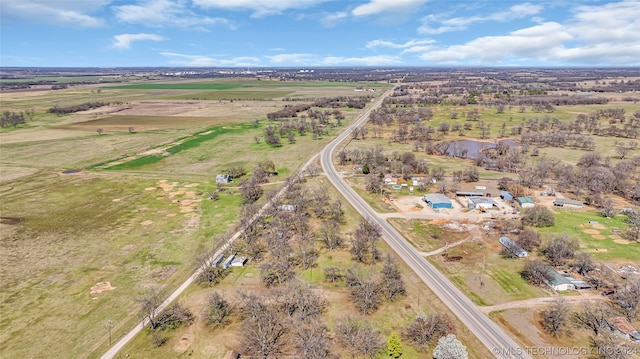 birds eye view of property featuring a rural view