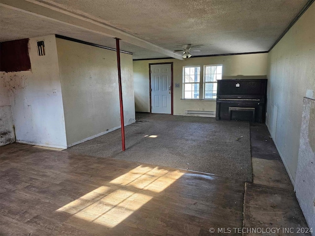 unfurnished living room with ceiling fan and baseboard heating