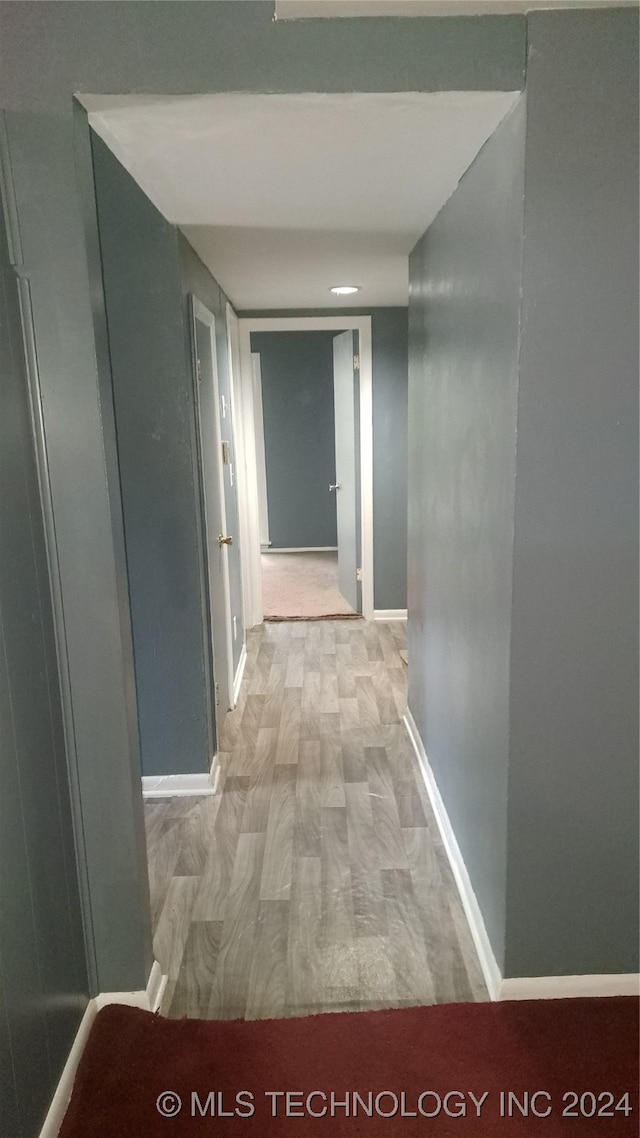 hallway with light wood-type flooring