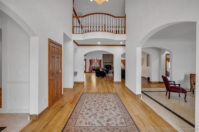 tiled entrance foyer featuring crown molding