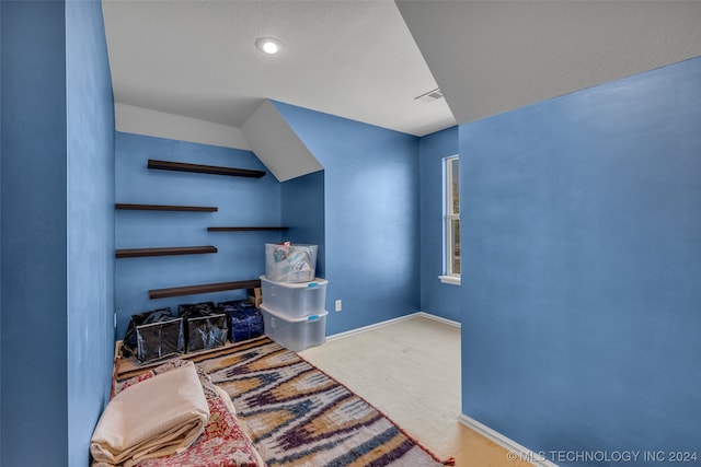 bedroom featuring light carpet