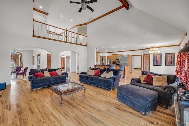 living room featuring high vaulted ceiling, beam ceiling, ceiling fan with notable chandelier, and light hardwood / wood-style flooring