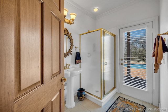 bathroom featuring tile floors, an enclosed shower, sink, and crown molding