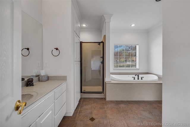 bathroom with crown molding, tile floors, vanity, and plus walk in shower