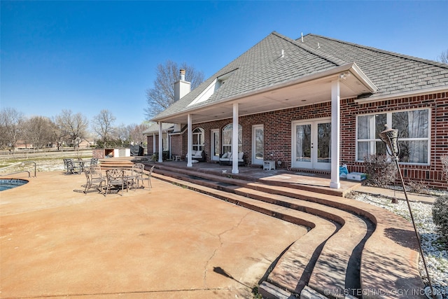 view of patio featuring french doors