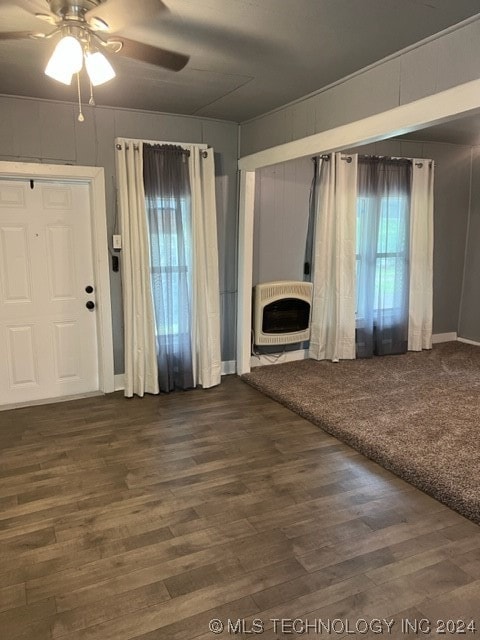 unfurnished living room with hardwood / wood-style floors and ceiling fan