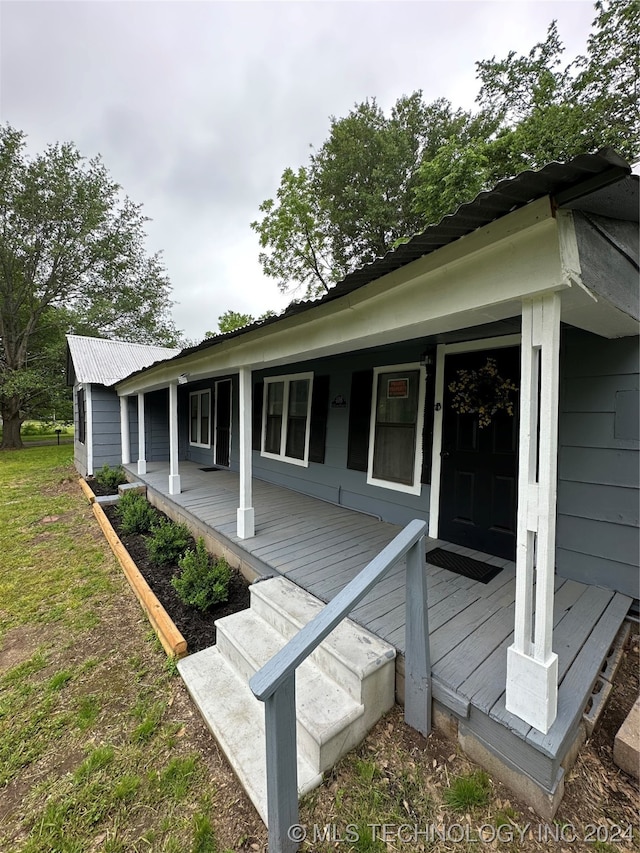 view of home's exterior with covered porch