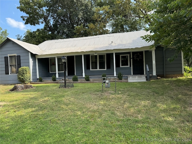 ranch-style house with a front lawn and covered porch