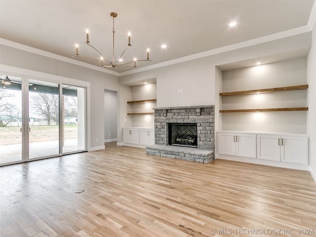 unfurnished living room with a stone fireplace, light hardwood / wood-style flooring, and crown molding