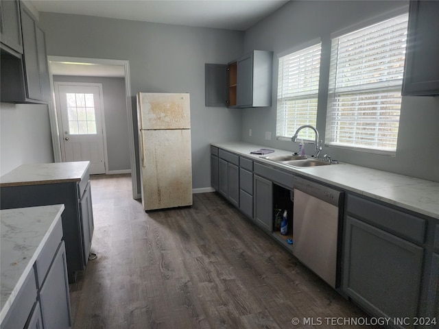 kitchen with dishwasher, white refrigerator, plenty of natural light, and gray cabinets