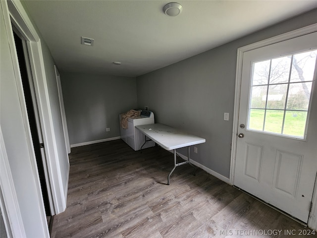 interior space featuring independent washer and dryer and wood-type flooring