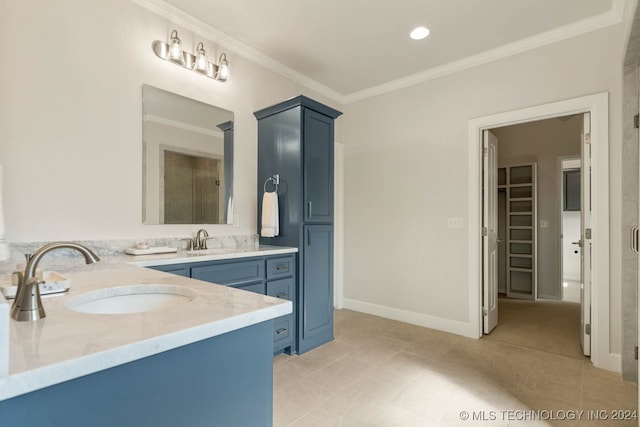 bathroom featuring crown molding, vanity, tile patterned floors, and a shower with door