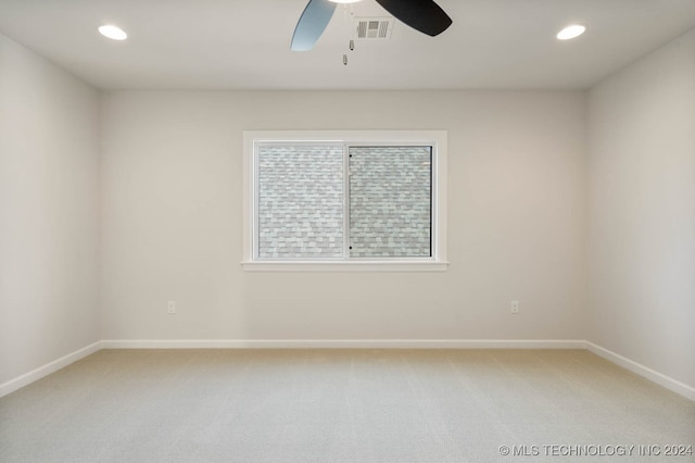 empty room featuring carpet and ceiling fan