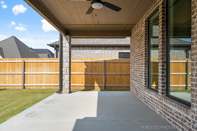 view of patio featuring ceiling fan