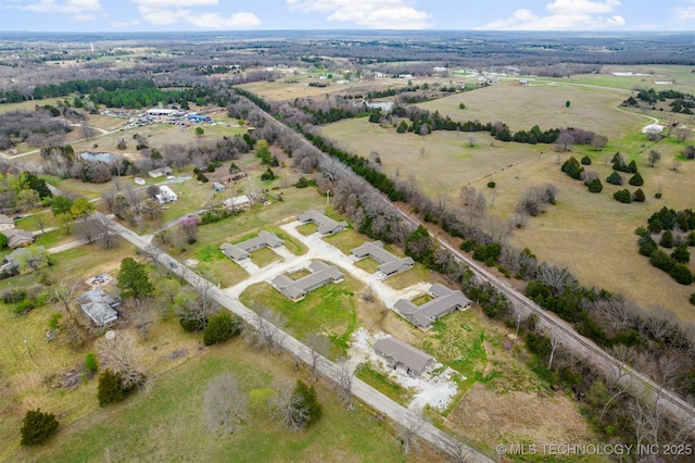 birds eye view of property featuring a rural view