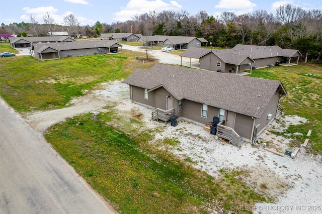 birds eye view of property with a residential view