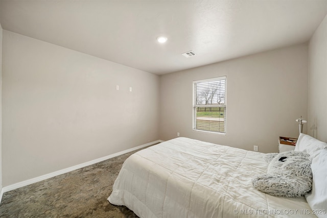 carpeted bedroom featuring visible vents and baseboards