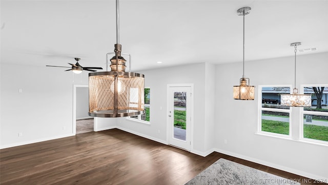 interior space with dark hardwood / wood-style floors and ceiling fan