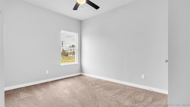 carpeted empty room with ceiling fan