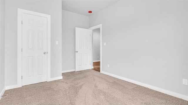 interior space featuring dark colored carpet