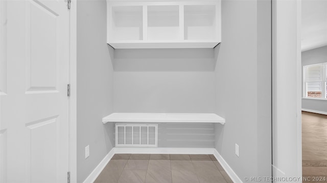 mudroom with light tile floors