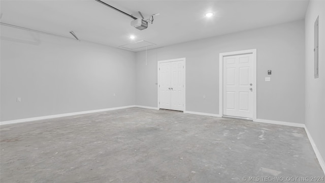 unfurnished room featuring concrete floors