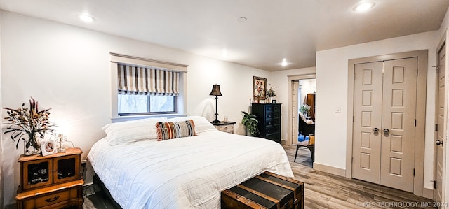 bedroom featuring light wood-type flooring