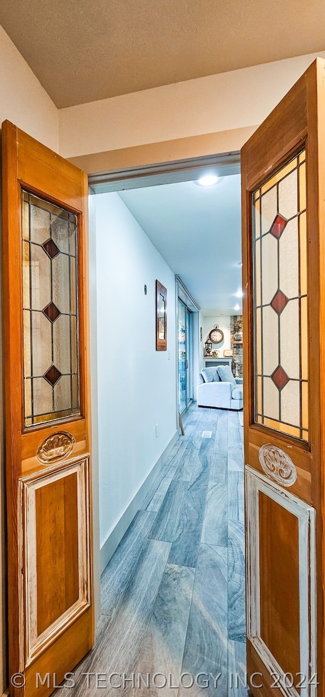 hallway featuring hardwood / wood-style floors