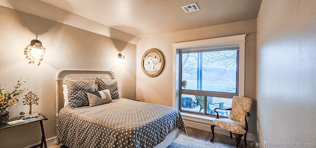 bedroom with wood-type flooring