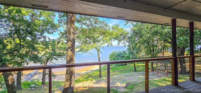 wooden terrace with a water view