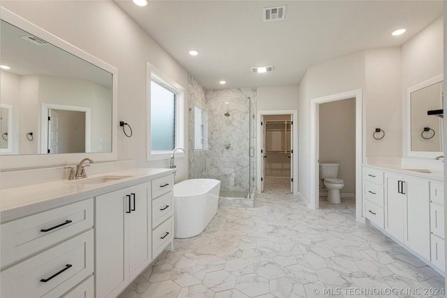 full bathroom featuring vanity, independent shower and bath, and toilet